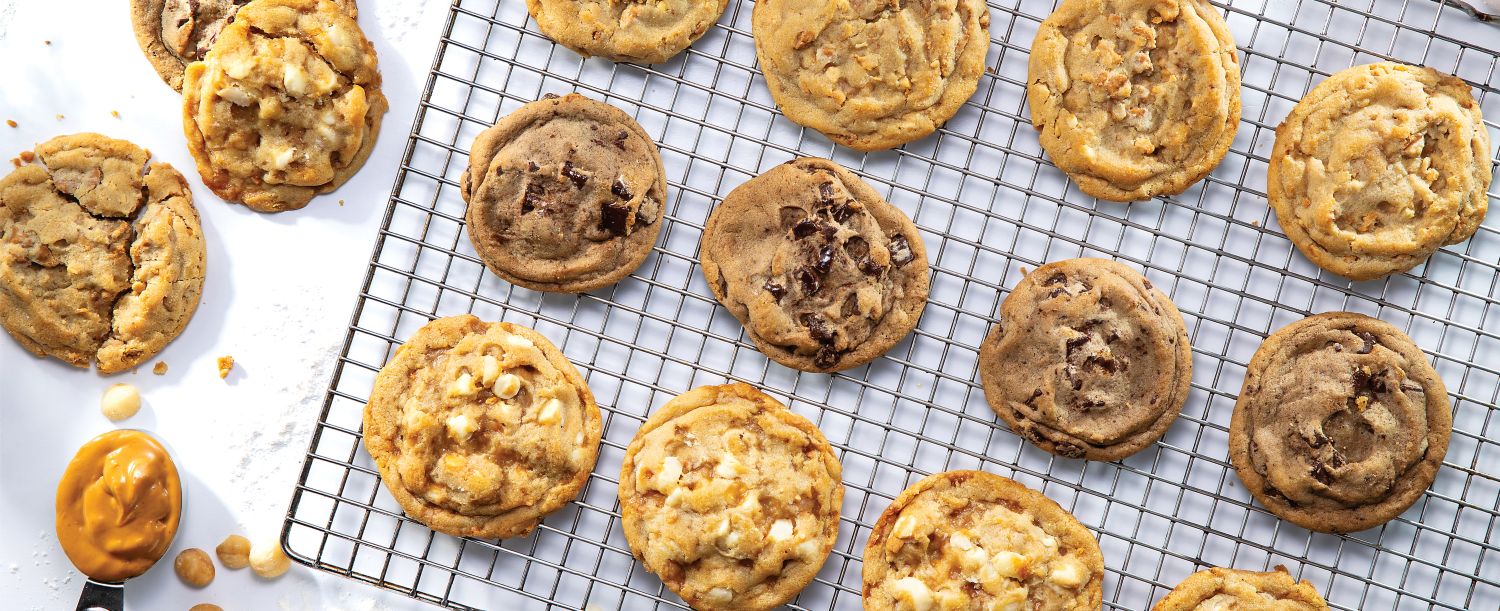 Chocolate chip cookies and macadamia nut cookies on a baking sheet